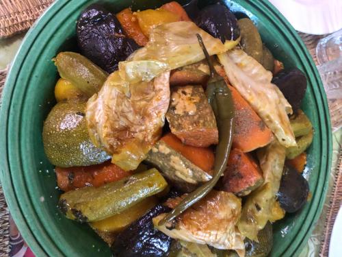 a green bowl of food with meat and vegetables at Maison d'Hôtes Irocha in Tisselday