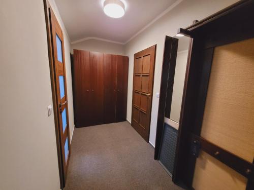 a hallway with two doors and a room with a hallway at Hotel STARÝ MLÝN in Jeseník