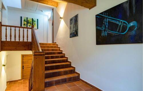 a staircase in a house with a painting on the wall at Hochmoderne Ferienwohnung Zams in Zams