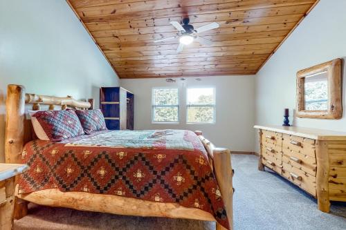 a bedroom with a bed and a wooden ceiling at Toccoa River Retreat in Suches