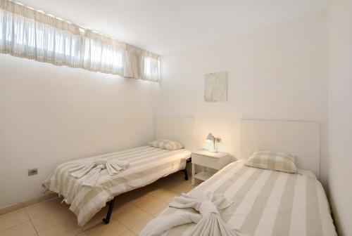 Posteľ alebo postele v izbe v ubytovaní Casa Médano 16 en el Médano