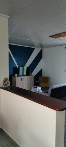 a counter top in a room with blue walls at Le petit cactus 2 in Bras-Panon