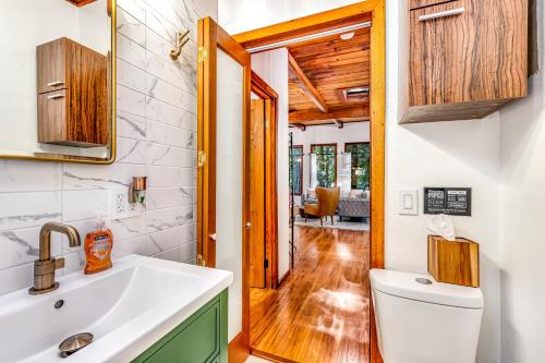 a bathroom with a sink and a toilet at Tree Tops Bungalow in Guerneville