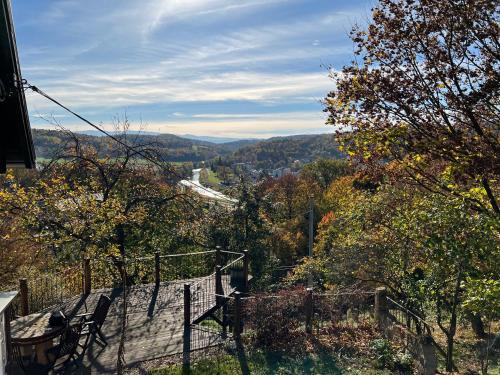 a room with a view of a hill with trees at Dom po schodkach in Wleń