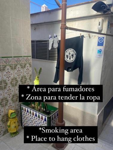 a towel hanging on a wall in a bathroom at Hotel Arce in San Pedro del Pinatar