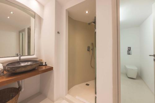 a bathroom with a sink and a shower at My Mykonos Hotel in Mýkonos City