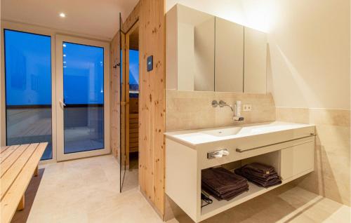 a bathroom with a sink and a mirror at 2 Bedroom Cozy Apartment In Zams in Zams