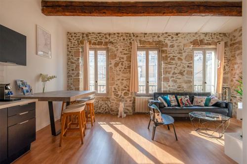 a living room with a couch and a table at Very Nice 58m Close To The Old Port in Marseille