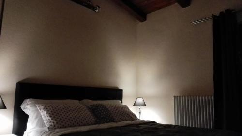 Cama o camas de una habitación en Il Piccolo Rifugio - L'Angoletto