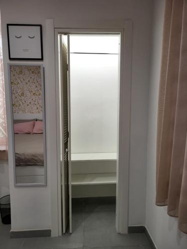 a bathroom with a mirror and a closet at Casa Monì in Naples