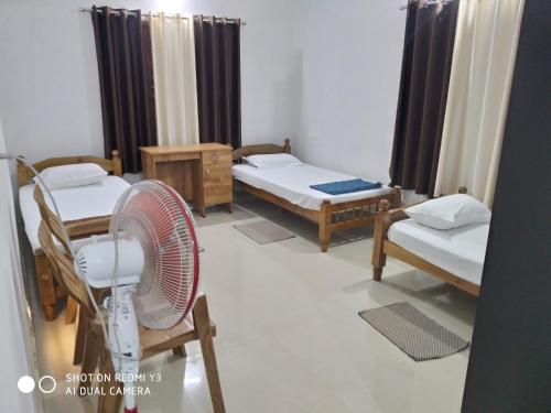 Katil atau katil-katil dalam bilik di Ammu's home stay