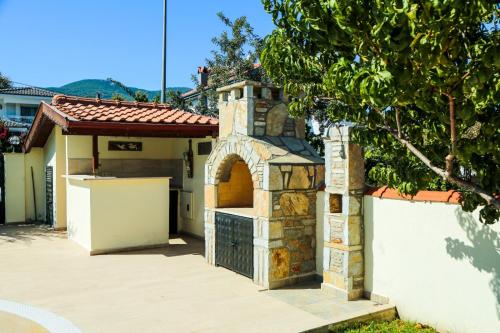 a building with a stone oven in a driveway at Villa Ahmet Dalyan 4 bedrooms in Dalyan