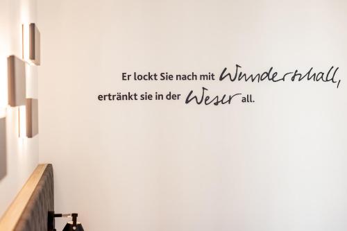 a wall decal with the quote if look she math hit mumble herself at Hotel zur Börse in Hameln