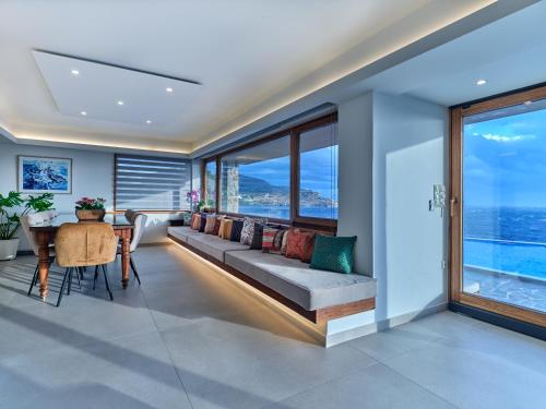 a living room with a couch and a table at Forecastle in Keratea