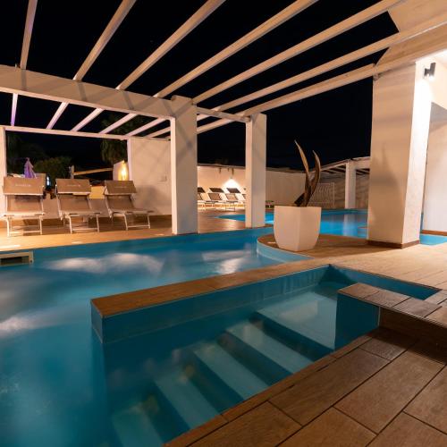 a swimming pool in a villa at night at Villa Edelweiss in Bacoli