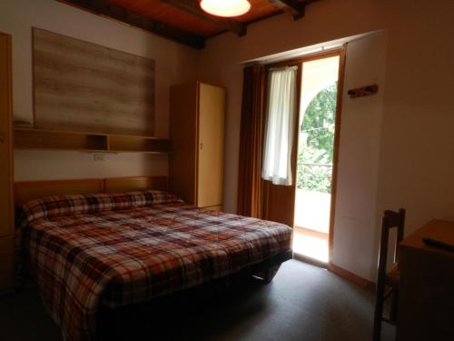Cama o camas de una habitación en Albergo Ristorante Villa Svizzera