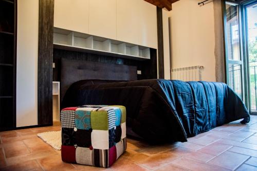 a living room with a bed and a fireplace at B & B CA’ D’ OLINA in Pavullo nel Frignano