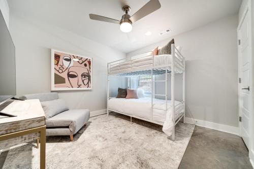 a bedroom with a bunk bed and a couch at Mayas Luxury Oasis 2 Miles To Broadway in Nashville