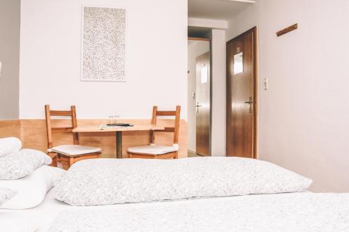 Postel nebo postele na pokoji v ubytování Pension s'Platzl Stuhleck