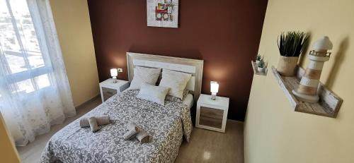 Ένα ή περισσότερα κρεβάτια σε δωμάτιο στο SunGolf Apartman