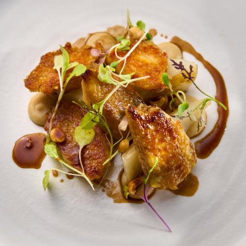 a white plate with food on a white plate at Castlemartyr Resort Hotel in Castlemartyr