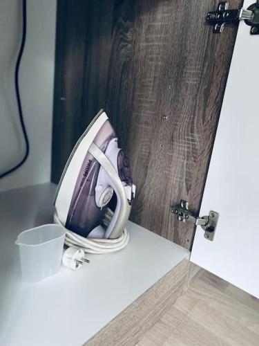 a picture of a phone with headphones on a table at Buer City Apartment mit Balkon in Gelsenkirchen