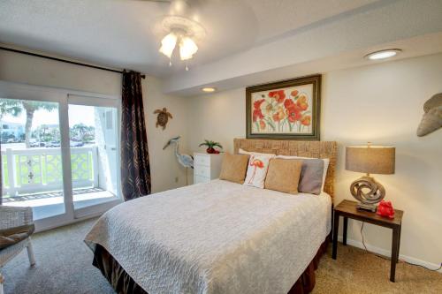 a bedroom with a large bed and a window at El Matador 224 - Centrally located to all the amenities at El Matador in Fort Walton Beach