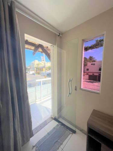 a room with a window with a view of the street at Sol de Bora Bora 101 in Salvador
