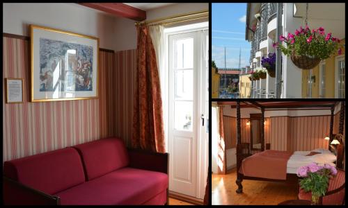 a living room with a red couch and a window at Hotel Ærø in Svendborg