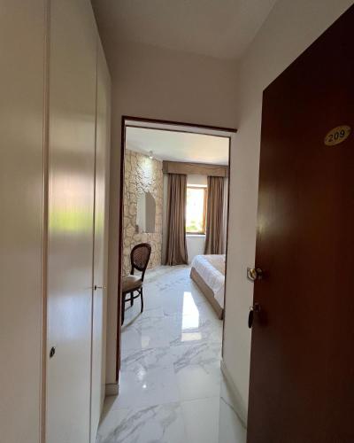 a hotel room with a bedroom and a bed at Villa Edelweiss in Bacoli