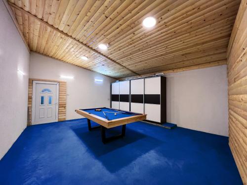 a pool table in a room with a wooden ceiling at Villa Sarajevo in Vareš
