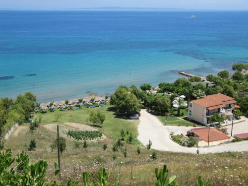 an aerial view of a villa and the beach at Levantino Studios & Apartments in Vasilikos