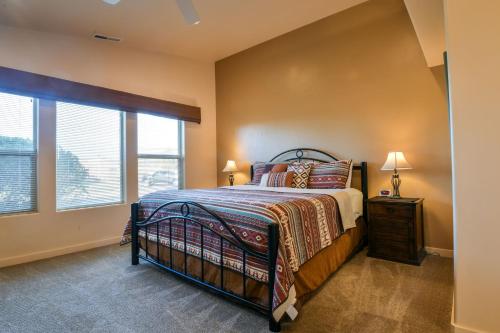 a bedroom with a bed and a window at Rim Village M4 in Moab