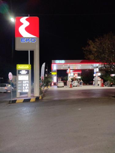 an egoco gas station at night with a gas pump at Periklis House in Ixia