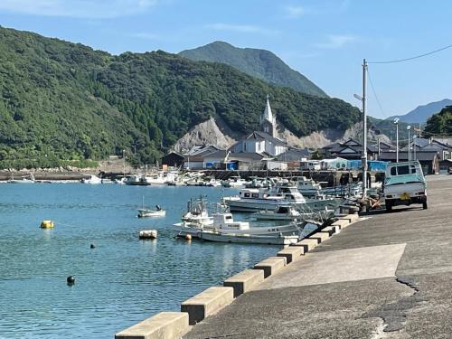 a group of boats in the water near a dock at Sakitsu house SEI - Vacation STAY 51020v in Amakusa