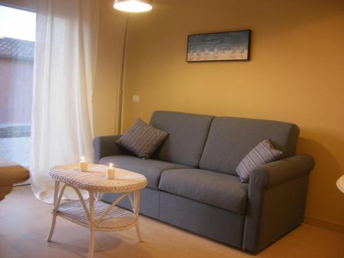 a living room with a couch and a table at Tenuta San Marcello in San Marcello