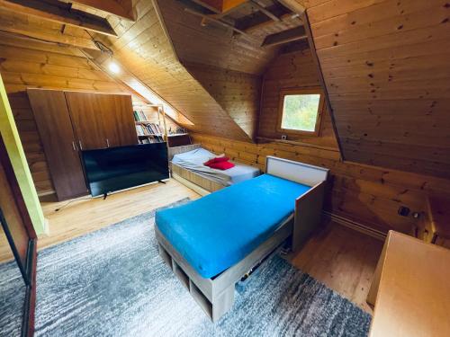 Posezení v ubytování Tantra klub - private room in a shared wooden house