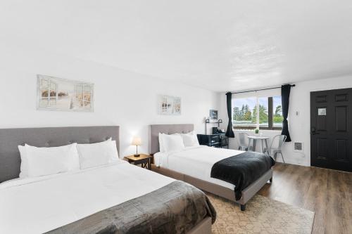 Postel nebo postele na pokoji v ubytování Silver Sands Motel