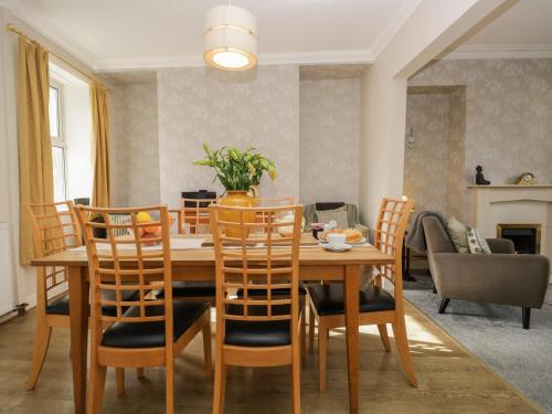 a dining room with a table and chairs at Bank House in Carnforth