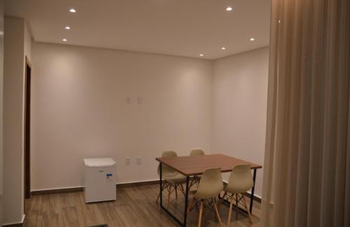 a dining room with a table and chairs at Pousada Flor de Alter in Alter do Chao