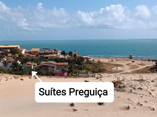 a view of a beach with the words suites pepita at Suítes Preguiça in Canoa Quebrada