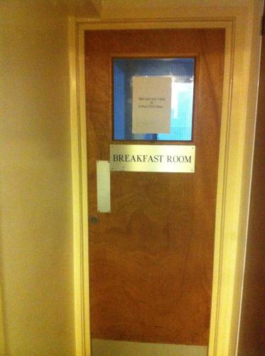 a sign on the door of a break least room at Colliers Hotel in London