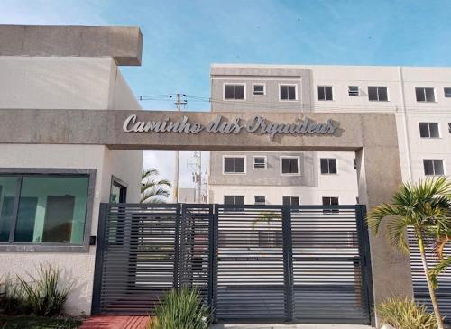 a building with a gate in front of it at Apto ao lado do Caruaru shopping 06 in Caruaru