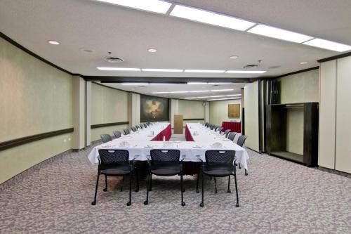 a large conference room with a long table and chairs at Chateau Lacombe Hotel in Edmonton