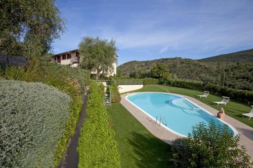 an overhead view of a swimming pool in a garden at Valle Del Buttero in Capalbio
