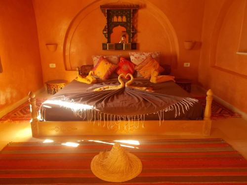 a bedroom with a bed with lights on it at Maison Leila chambres d hotes in Midoun