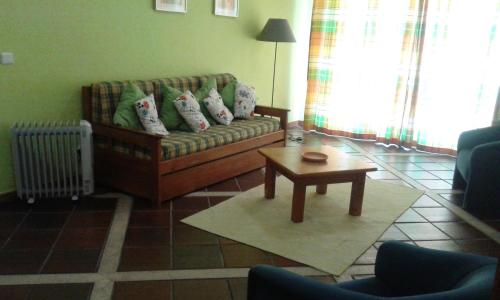 a living room with a couch and a coffee table at HI Almada - Pousada de Juventude in Almada