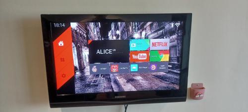 a flat screen tv hanging on a wall at SY Staycation - Studio in Bayan Lepas