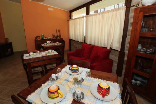 a living room with a table with food on it at B&B Masseria Caporelli in San Costantino Calabro