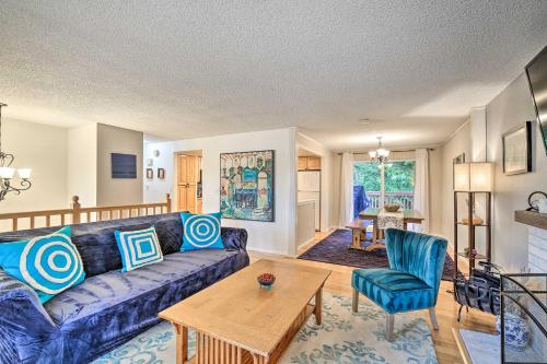 a living room with a couch and a table at Spacious Kent Getaway with Yard, Deck and Grill! in Kent
